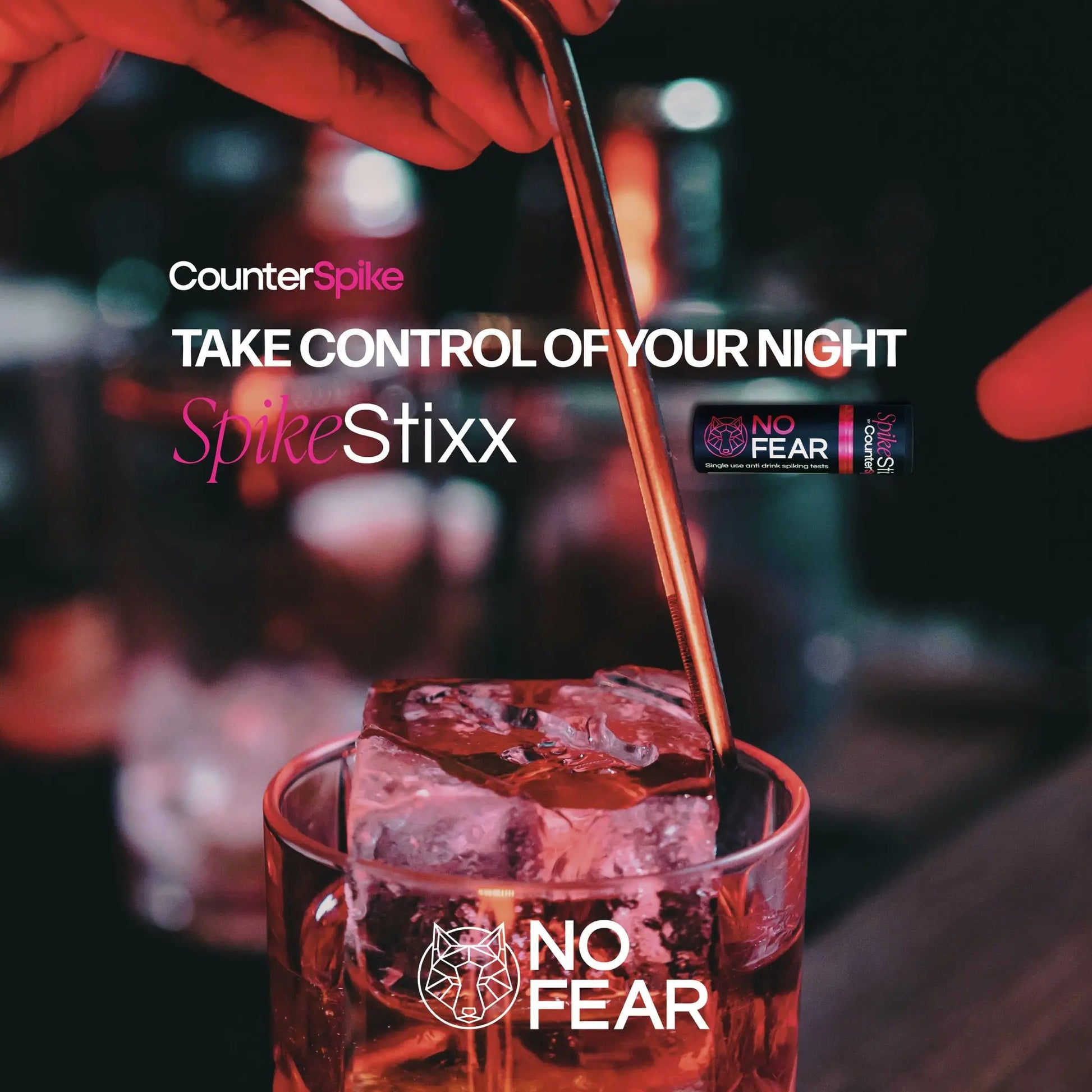 Person pouring a drink into a glass with 'No Fear' branding, featuring 'CounterSpike' and 'SpikeStixx' products.